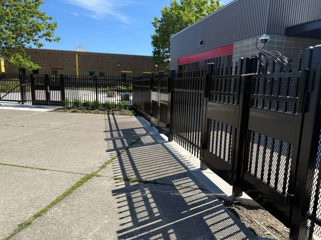 Galvanized security chain link perimeter fence installed at a school campus